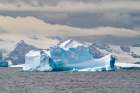 Antarctica, South Orkney Islands. Landscape with iceberg and mountains. Art Print